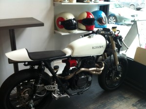 Restored vintage Honda motorcycle parked in a cafe in Brooklyn. 